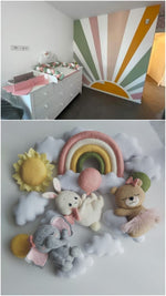 Giostrina culla con arcobaleno, animaletti e nuvole in feltro, abbinata alla cameretta del neonato