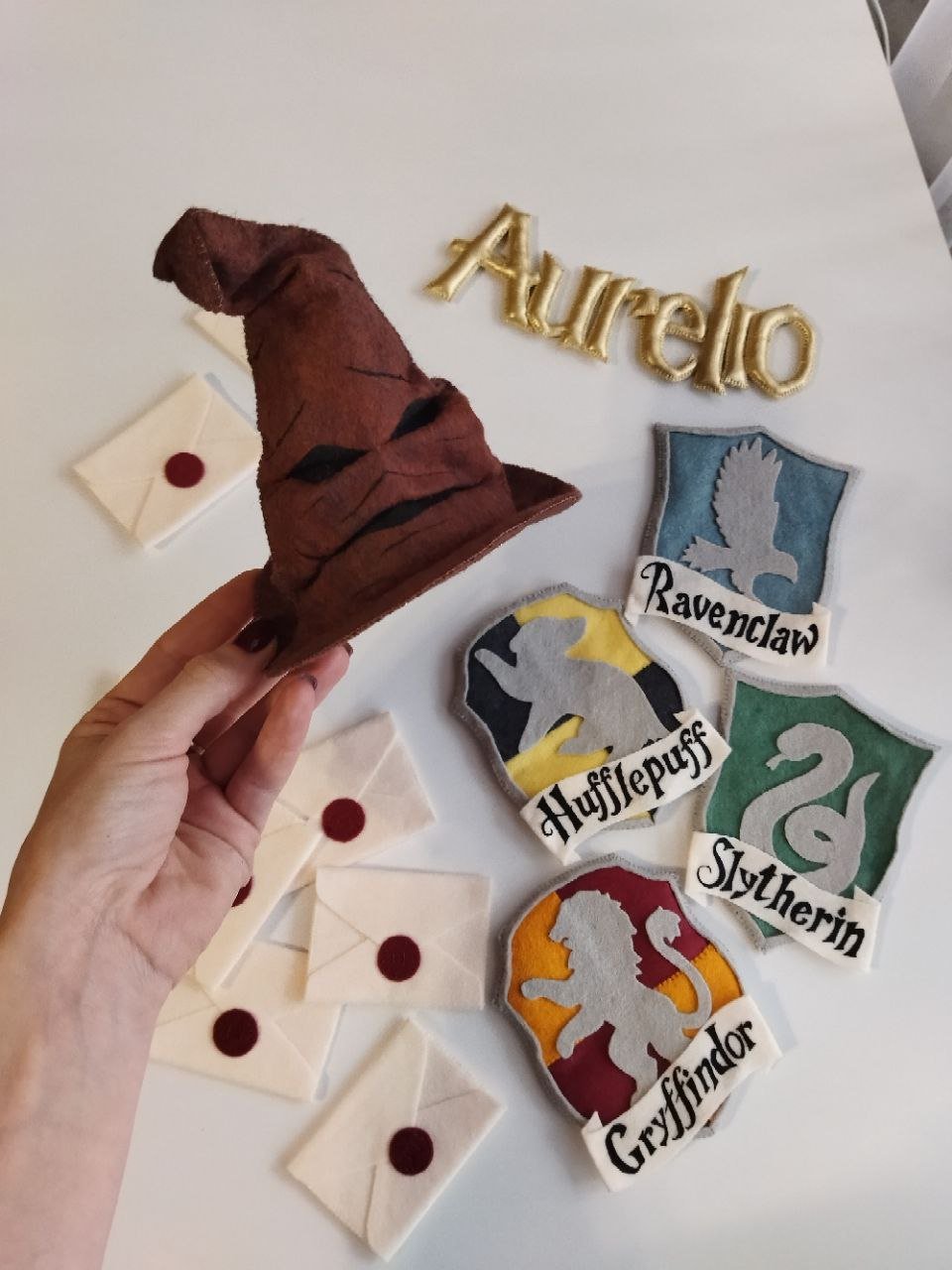 Giostrina Musicale Le case di Hogwarts: Grifondoro, Serpeverde, Corvonero, Tassorosso - universo del bambino