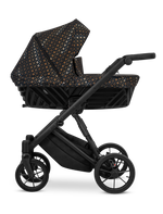 Passeggino Ivento Kunert Black Style navicella nera fantasia oro telaio tutto nero vista laterale