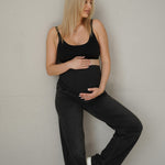 Jeans gravidanza neri in denim con elastan, fascia vita alta in maglia che si allarga insieme al pancione