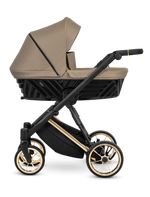 Kunert Ivento navicella in tessuto beige caramel, telaio nero con barra oro e cerchi dorati