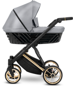 Navicella Kunert Ivento in ecopelle grigio metallizzato con telaio nero, barra dorata e ruote con cerchi oro