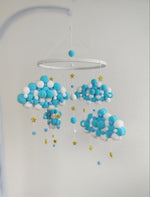 Giostrина musicale culla nuvole pon pon feltro turchese e bianco con stelline glitter oro per neonato