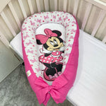 Riduttore nido neonata Minnie Disney rosa ciclamino, baby nest a pois e fiocchi per lettino bimba.