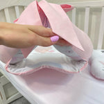Cerniera sul fondo del riduttore nido rosa aperta, baby nest sfoderabile e lavabile con fodera rimovibile per culla.