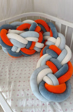 Treccia paracolpi a 8 fili arancio e azzurro arrotolata, usabile anche come cuscino decorativo