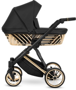 Passeggino Kunert Ivento nero con scocca geometrica, telaio e cerchioni delle ruote color oro lucido